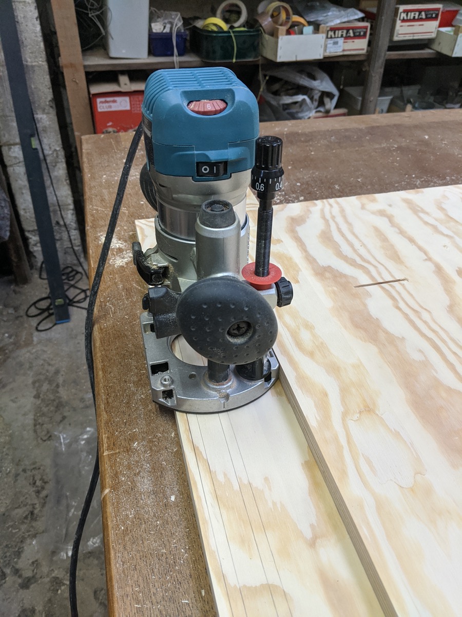 Routing grooves with my Makita router, dust all over the place